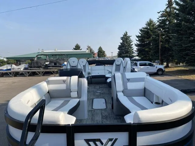 Slide: The Image of 2022 Viaggio D23Q pontoon boat with white seating and spacious deck. - 9