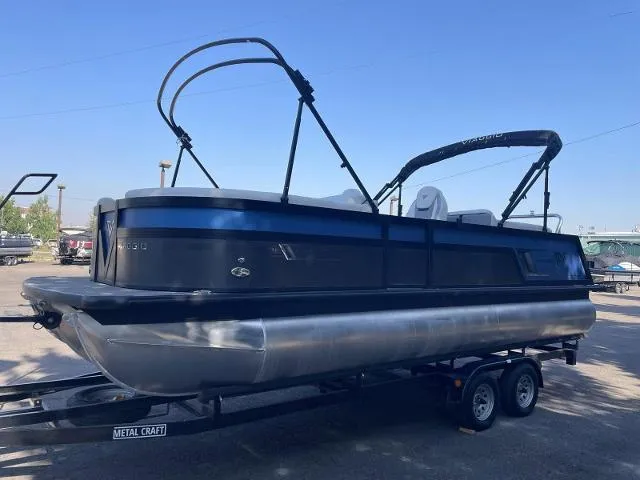 Slide: The Image of 2022 Viaggio D23U pontoon boat on a trailer in a parking lot. - 4