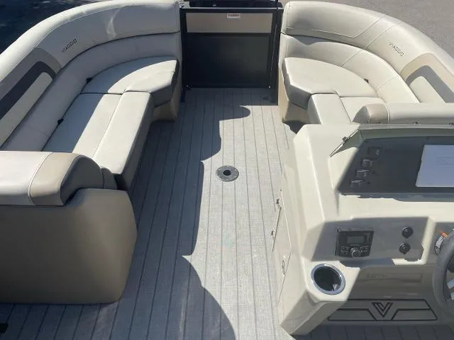 Slide: The Image of 2022 Viaggio L22S boat interior with spacious seating and modern dashboard. - 8