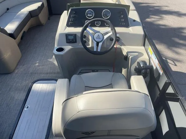 Slide: The Image of Viaggio L22U 2022 boat interior with steering wheel and seating. - 10