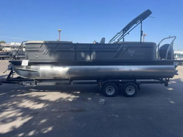Slide: The Image of 2022 Viaggio L22U pontoon boat on a trailer under clear blue sky. - 3