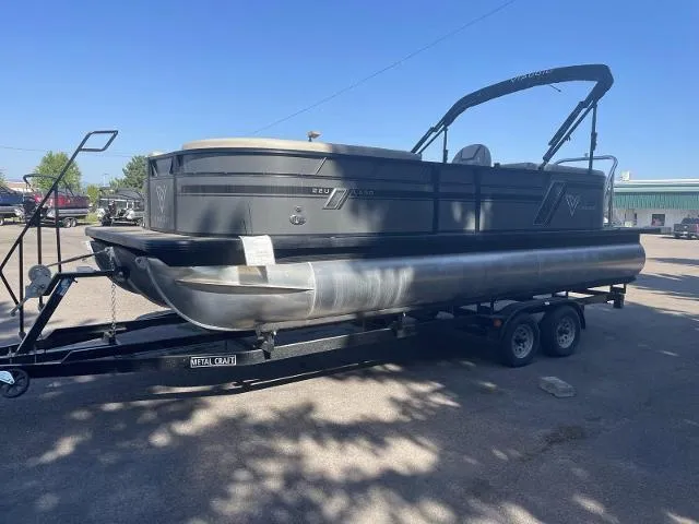 Slide: The Image of 2022 Viaggio L22U pontoon boat on a trailer in a parking lot. - 4
