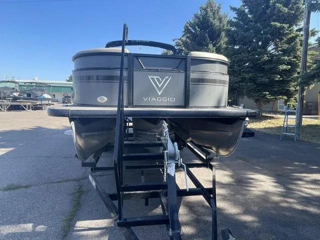Slide: The Image of 2022 Viaggio L22U pontoon boat on a trailer in a parking lot. - 7