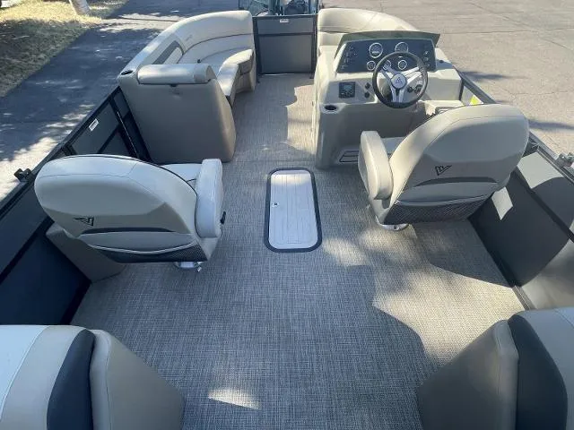 Slide: The Image of 2022 Viaggio L22U pontoon boat interior with spacious seating and modern dashboard. - 8