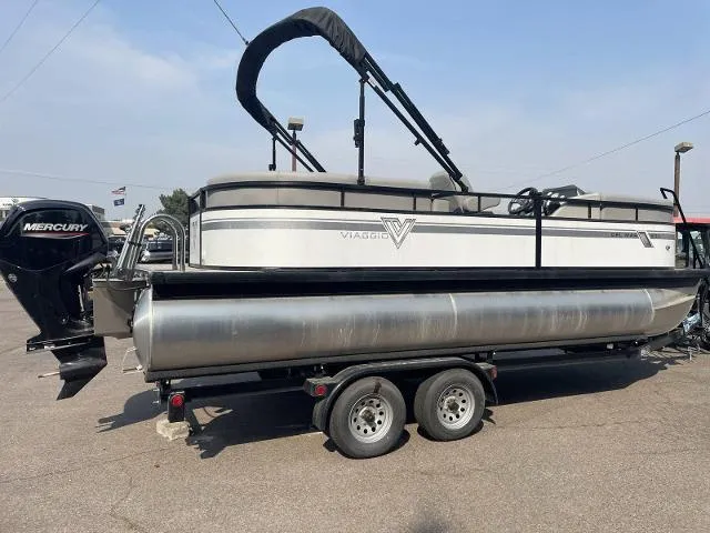 Slide: The Image of 2022 Viaggio DM20U pontoon boat on trailer with Mercury outboard motor. - 1