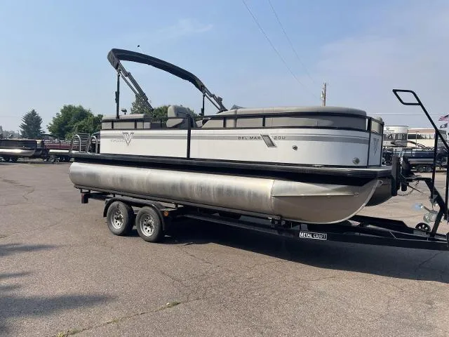 Slide: The Image of 2022 Viaggio DM20U pontoon boat on trailer in parking lot. - 2