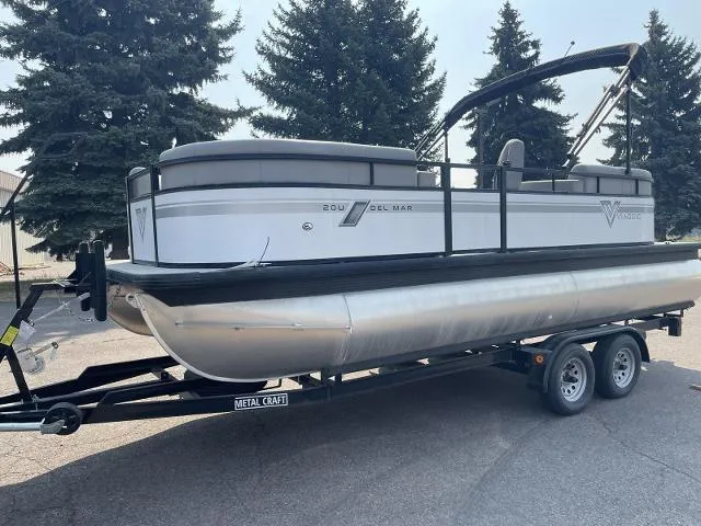 Slide: The Image of 2022 Viaggio DM20U pontoon boat on a trailer, parked outdoors. - 3