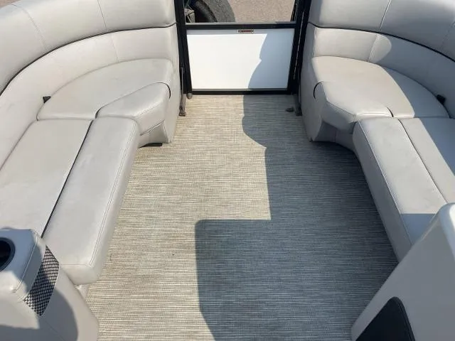 Slide: The Image of Interior of 2022 Viaggio DM20U pontoon boat with gray seating and carpeted floor. - 7