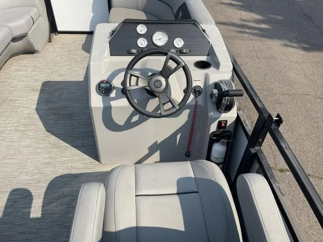 Slide: The Image of 2022 Viaggio DM20U boat cockpit with steering wheel, gauges, and seating. - 9