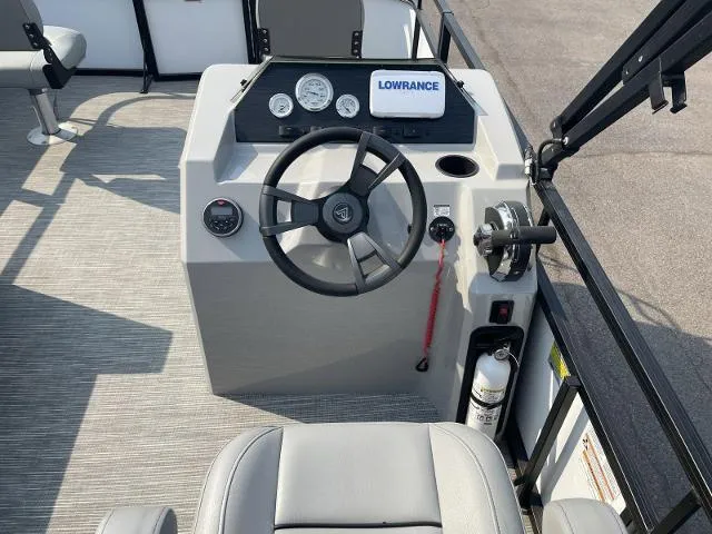 Slide: The Image of Viaggio DM16F 2022 boat dashboard with steering wheel, gauges, and Lowrance device. - 4