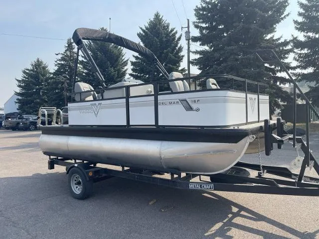 Slide: The Image of 2022 Viaggio DM16F pontoon boat on trailer, outdoor setting. - 8