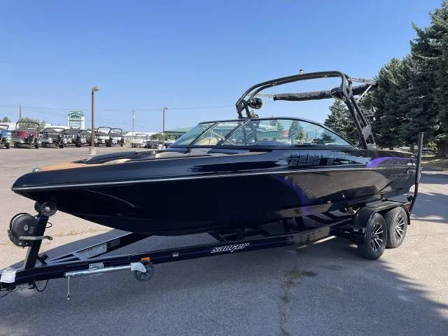 Slide: The Image of 2023 Sanger V237 SX black boat on trailer in parking lot. - 1