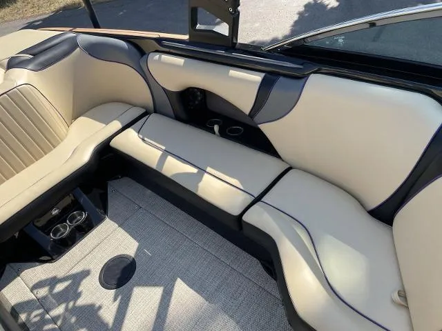 Slide: The Image of 2023 Sanger V237 SX boat interior with beige and black seating. - 11