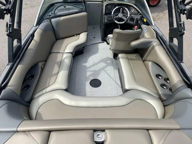 Slide: The Image of 2023 Sanger V-215 SX boat interior with gray and beige seating. - 12