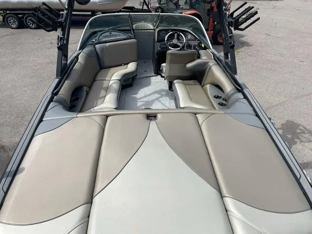 Slide: The Image of 2023 Sanger V-215 SX boat interior with beige and gray seating. - 13