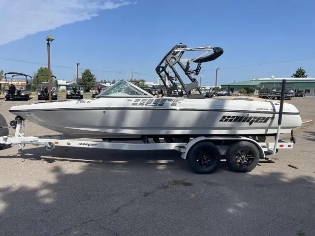 Slide: The Image of 2023 Sanger V215 Special boat on trailer in parking lot. - 2