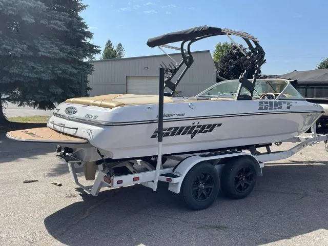 Slide: The Image of 2023 Sanger V215 Special boat on a trailer in a parking lot. - 1