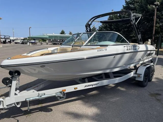 Slide: The Image of 2023 Sanger V215 Special boat on trailer, white exterior, parked outdoors. - 3