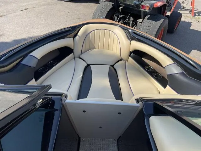 Slide: The Image of 2023 Sanger V215 Special boat interior with beige and black seating. - 9