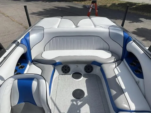 Slide: The Image of 2023 Sanger V215 SX boat interior with white and blue seating. - 12