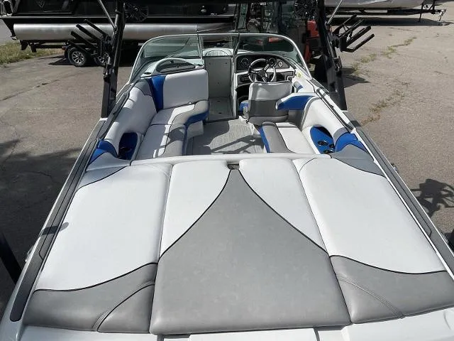 Slide: The Image of 2023 Sanger V215 SX boat interior with white and blue seating. - 13