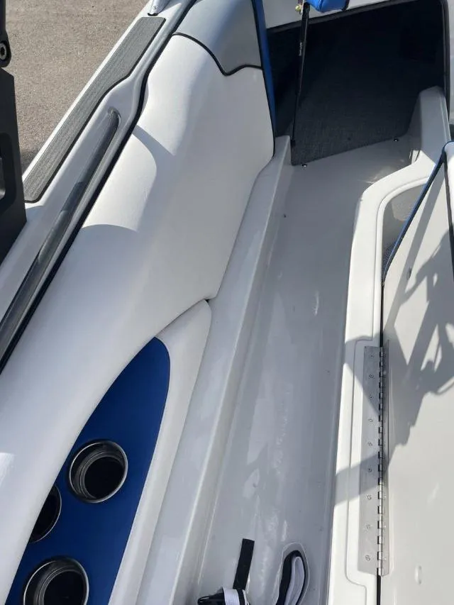 Slide: The Image of 2023 Sanger V215 SX boat interior with white and blue seating. - 7