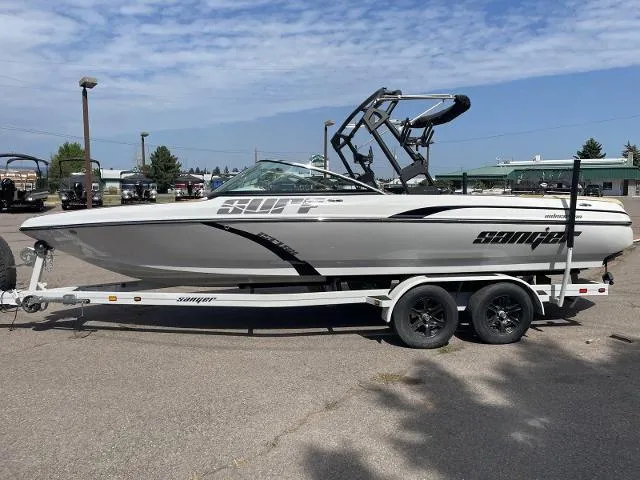 Slide: The Image of 2023 Sanger V237 SX boat on a trailer in a parking lot. - 3