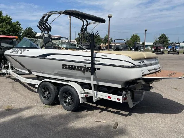 Slide: The Image of 2023 Sanger V237 SX boat on a trailer in a parking lot. - 4