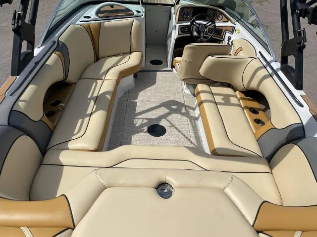 Slide: The Image of 2023 Sanger V237 SX boat interior with beige and tan seating. - 8