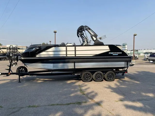 Slide: The Image of 2023 Montara Surf Boss 202 boat on a trailer in a parking lot. - 3