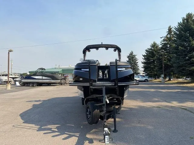 Slide: The Image of 2023 Montara Surf Boss 202 boat on a trailer in a parking lot. - 6