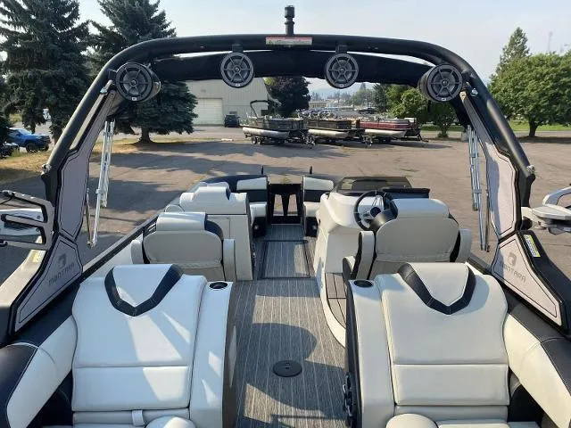 Slide: The Image of 2023 Montara Surf Boss 202 boat interior with luxury seating and advanced audio system. - 9