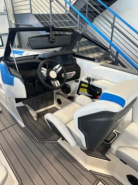 Slide: The Image of 2024 Nautique GS24 boat interior with modern helm and seating. - 7