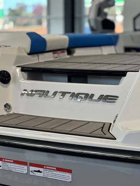 Slide: The Image of 2024 Nautique GS24 boat rear deck with logo. - 8