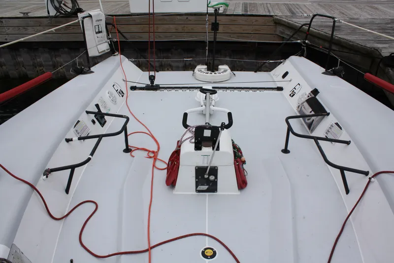 Slide: The Image of Farr 40 sailboat deck, 2004 model, with ropes and winches at dock. - 12