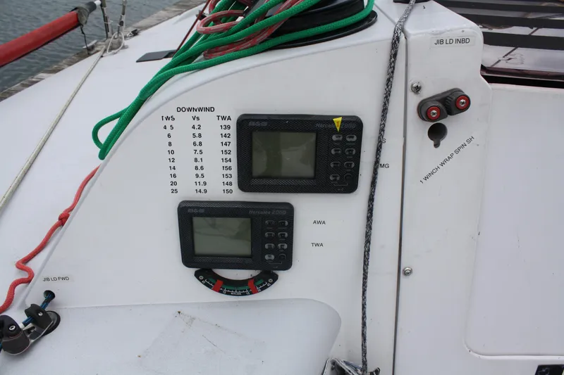 Slide: The Image of Sailing instruments on a 2004 Farr 40 yacht with ropes and wind data display. - 14
