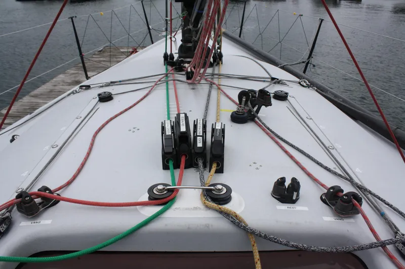 Slide: The Image of Deck of 2004 Farr 40 sailboat with colorful rigging and hardware. - 18