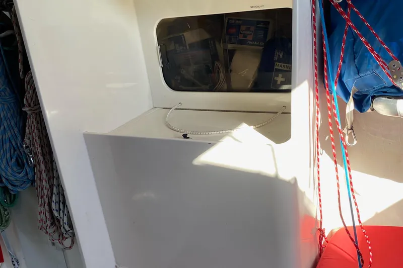 Slide: The Image of Interior of 2004 Farr 40 sailboat with ropes and storage compartment. - 41