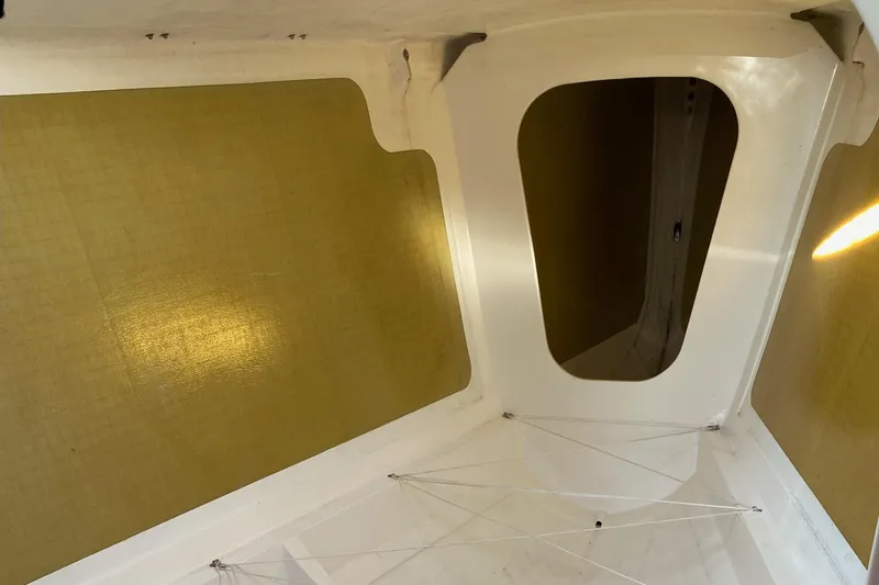 Slide: The Image of Interior view of a 2004 Farr 40 sailboat, featuring a sleek, modern design. - 42