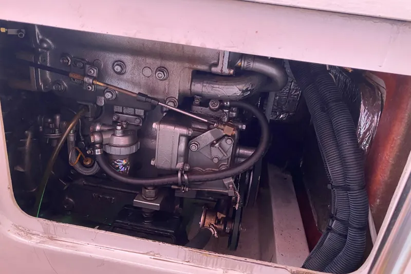 Slide: The Image of Engine compartment of a 2004 Farr 40 sailboat, showcasing mechanical components. - 46