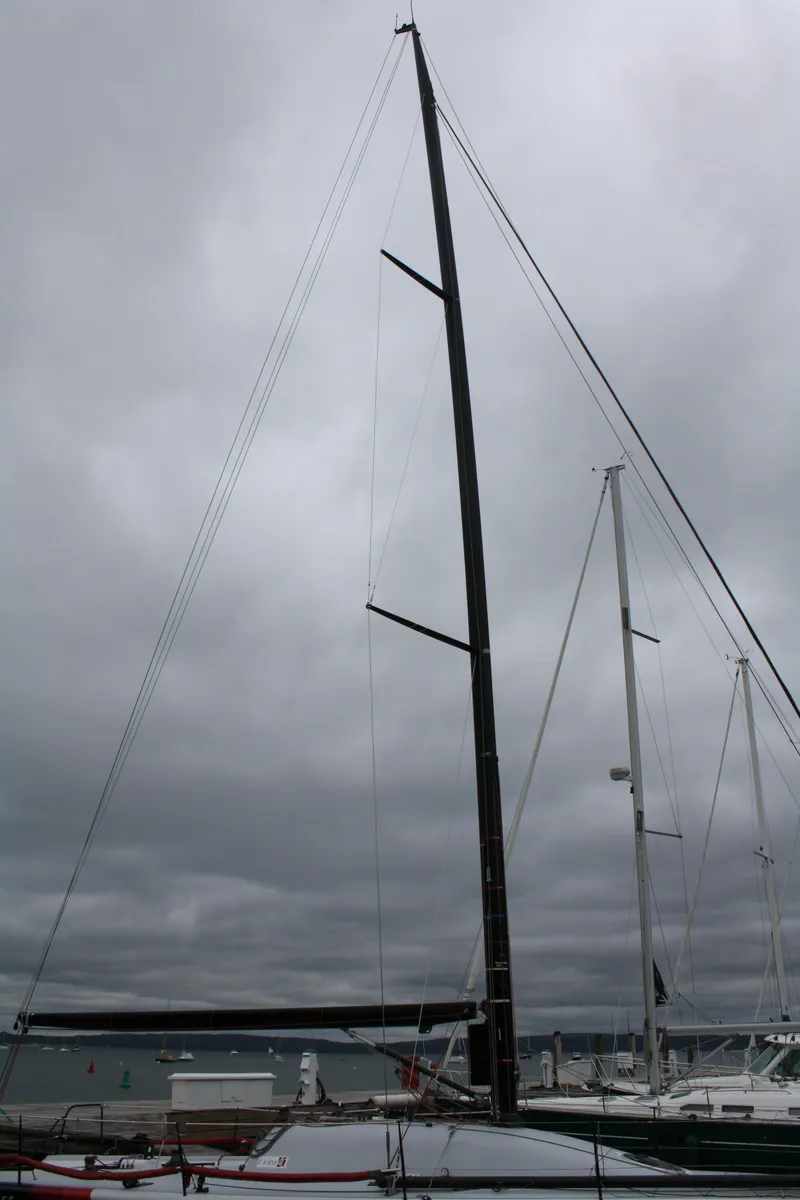 Slide: The Image of Sailboat with tall mast, Farr 40 model, 2004, under cloudy sky. - 48