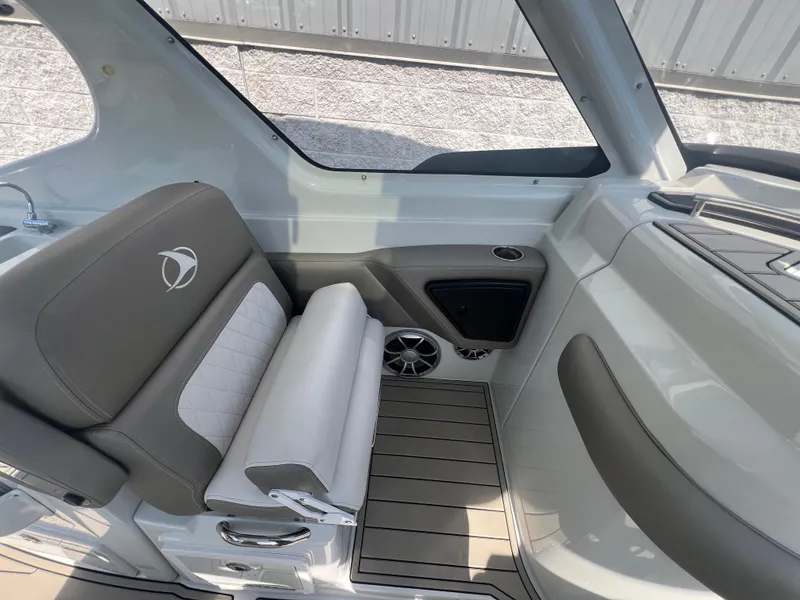 Slide: The Image of 2023 Finseeker 280 DC boat interior with cushioned seating and modern design. - 15
