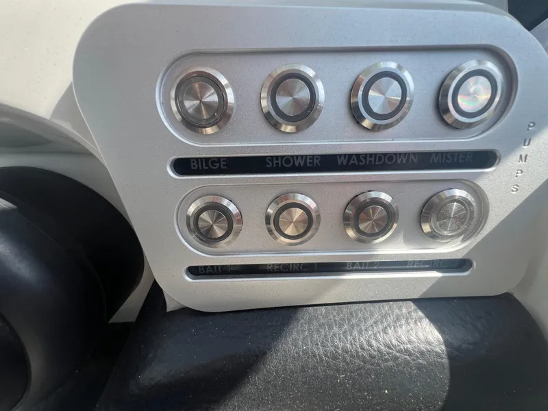 Slide: The Image of Control panel of 2023 Finseeker 280 DC boat with pump buttons. - 17