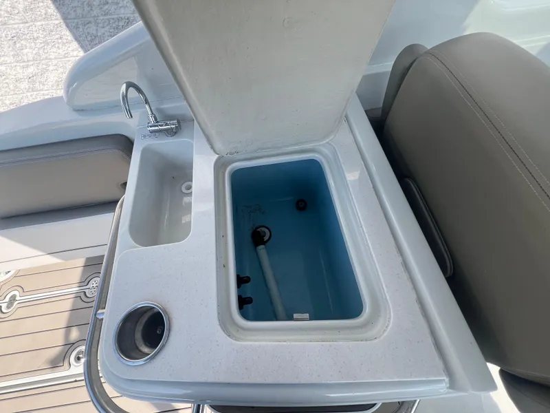 Slide: The Image of 2023 Finseeker 280 DC boat sink and storage compartment detail. - 20