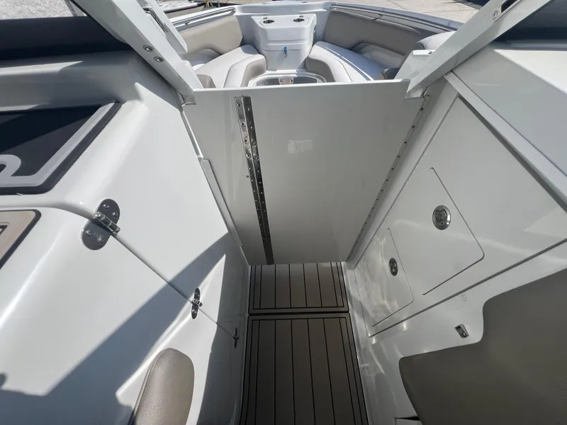 Slide: The Image of 2023 Finseeker 280 DC boat interior with seating and storage compartments. - 22