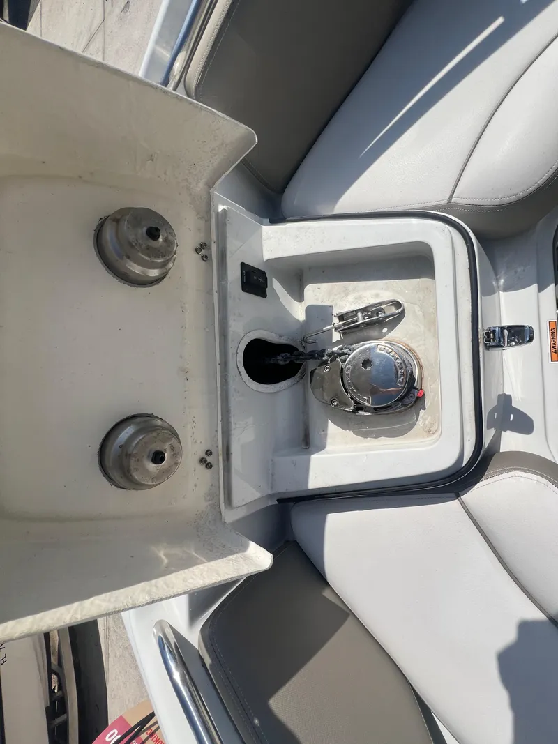 Slide: The Image of 2023 Finseeker 280 DC boat interior with anchor storage and seating area. - 24