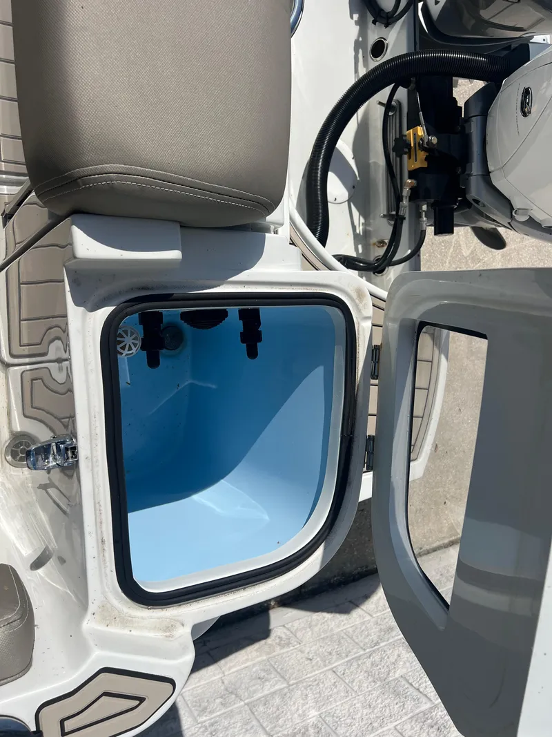 Slide: The Image of Open storage compartment on 2023 Finseeker 280 DC boat, showcasing interior details. - 26