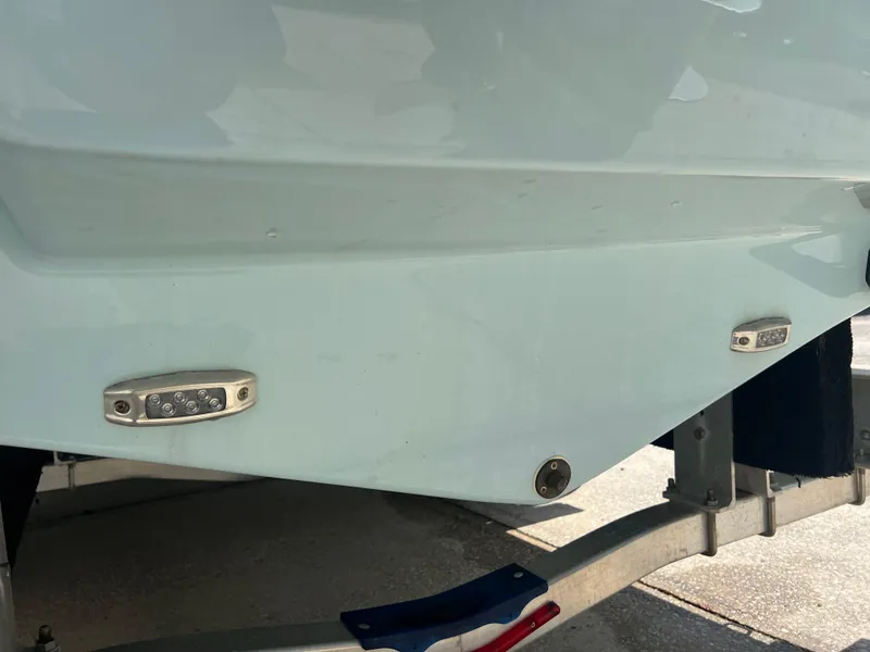 Slide: The Image of 2023 Finseeker 280 DC boat hull with underwater lights on a trailer. - 29