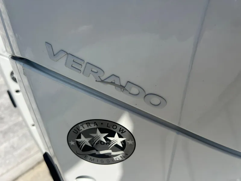 Slide: The Image of Close-up of Verado engine on 2023 Finseeker 280 DC, featuring ultra-low emission label. - 33
