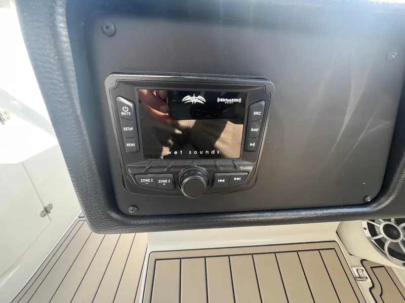 Slide: The Image of Control panel of 2023 Finseeker 280 DC boat with audio system. - 34